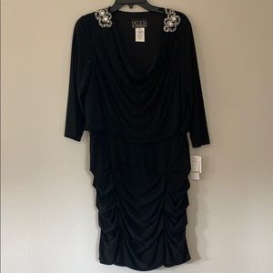 A black ruffled Alex dress with gems on shoulders